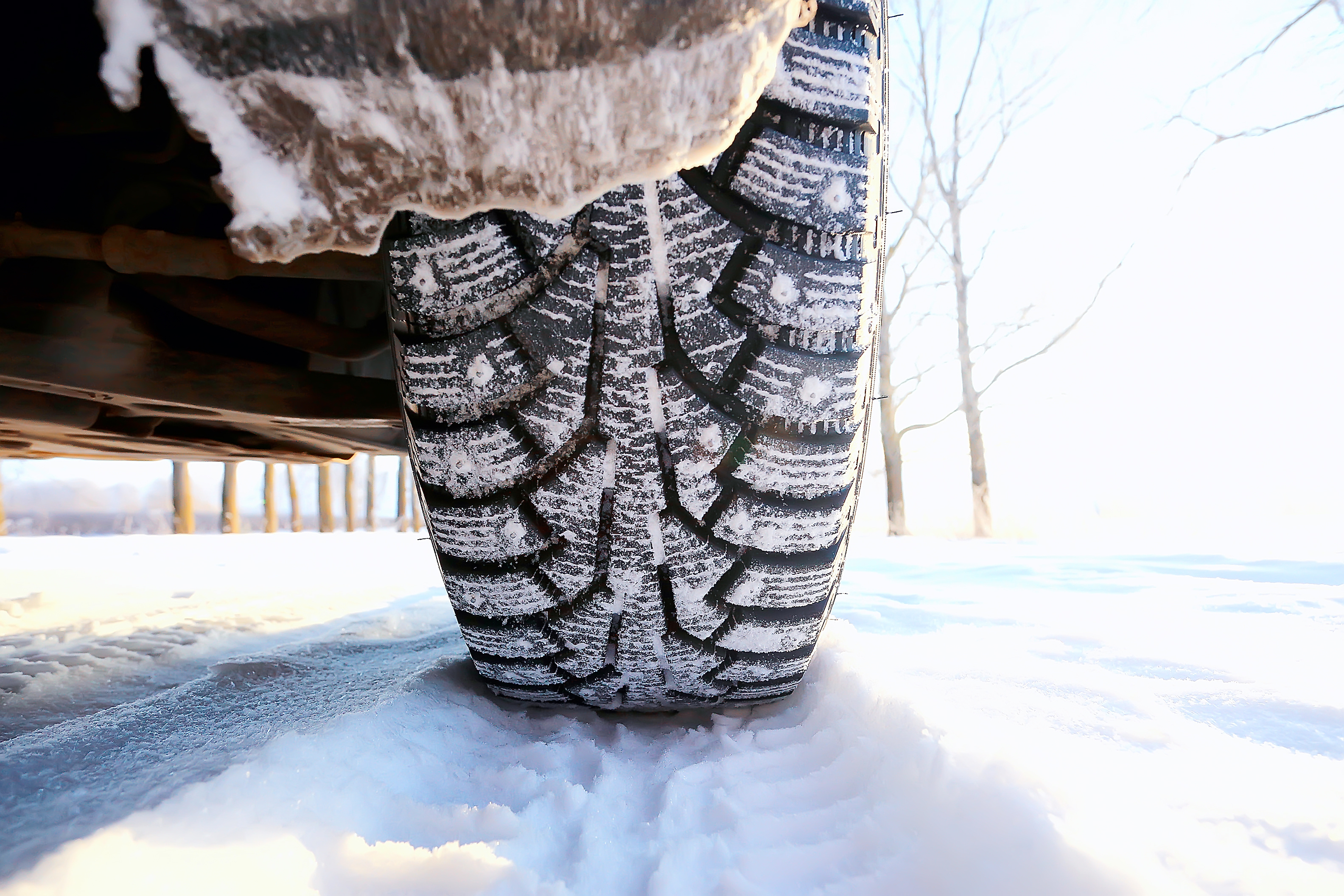 Studded winter tire on the snow