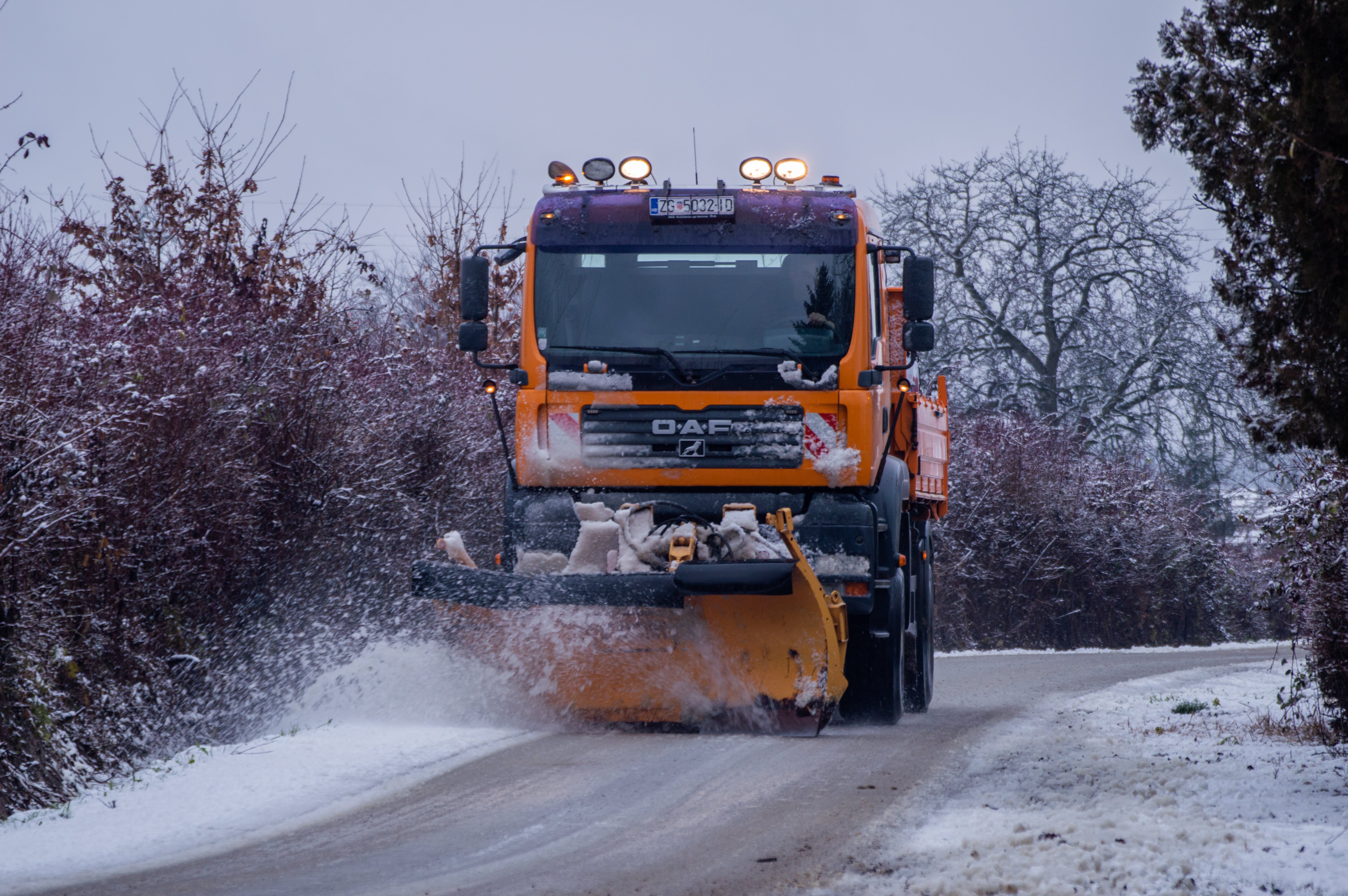 Snow plow on road