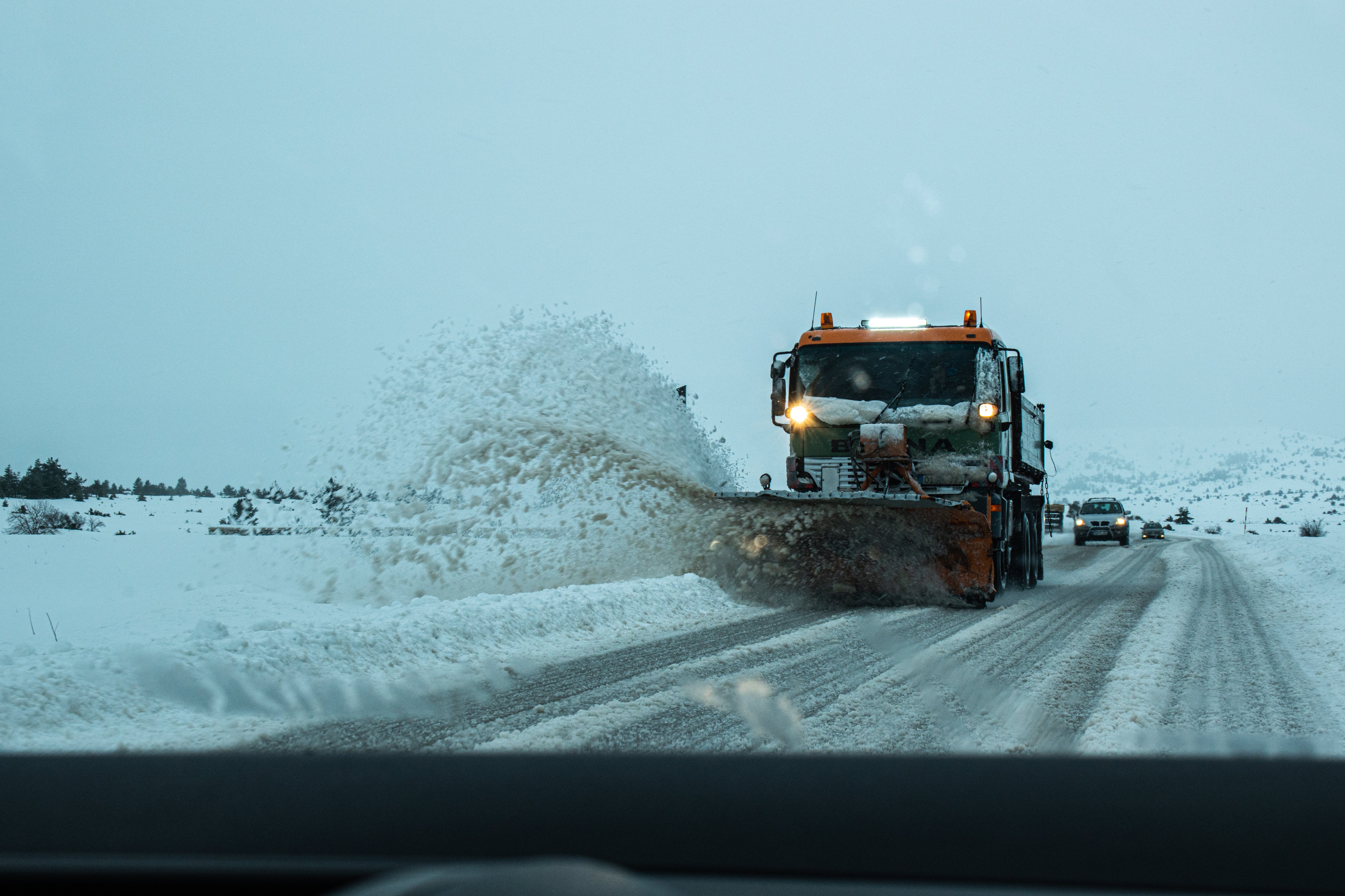 Snow plow moving snow