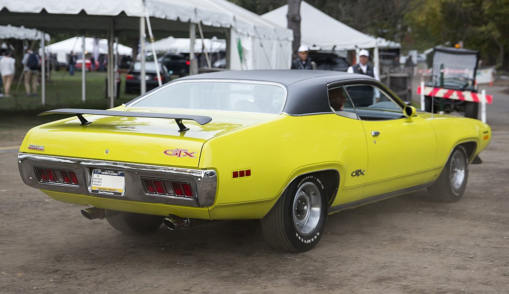 Close-up photo of a 1971 Plymouth GTX Hemi in Curious Yellow