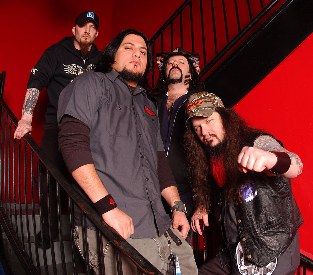 Heavy metal band Damageplan poses for a portrait backstage April 7, 2004 in Chicago, Illinois