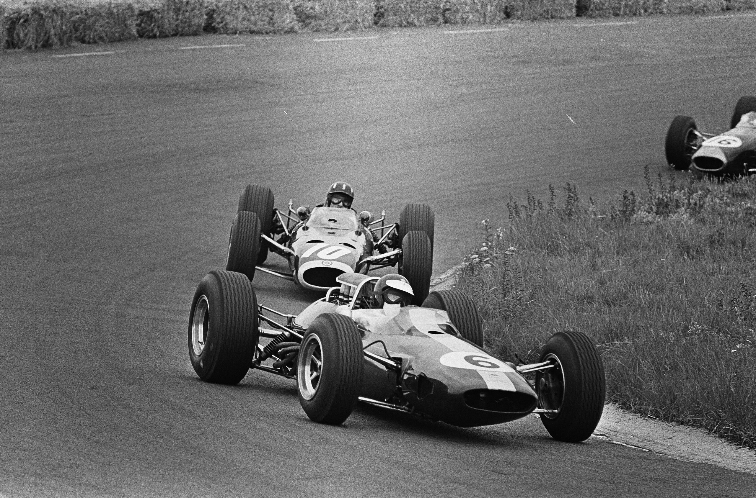 Jim Clark (6) followed by Graham Hill (10) driving