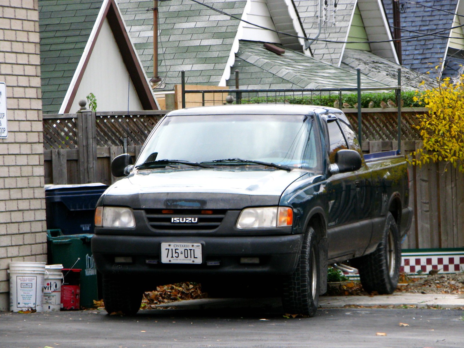 Black Isuzu Hombre outside.
