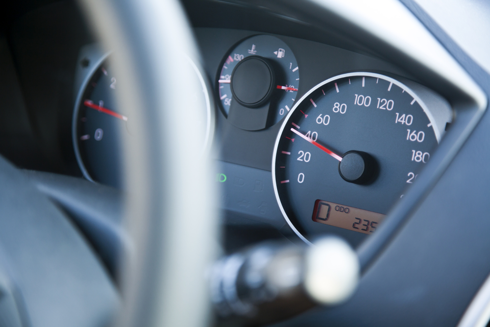 The dashboard of car going 40, within speed limits.