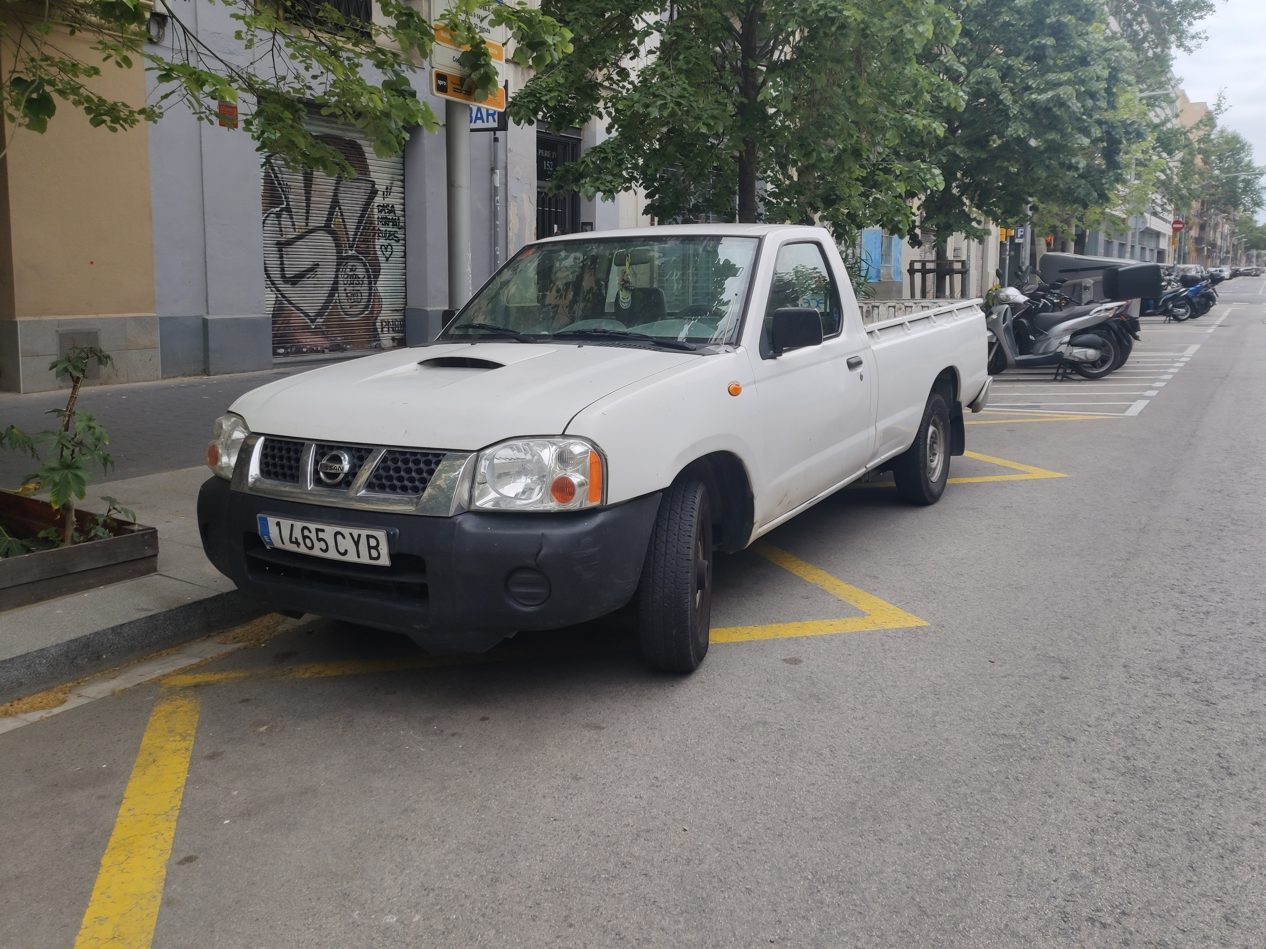 Front view of an old first generation Nissan Navara D22 pickup truck from 1997