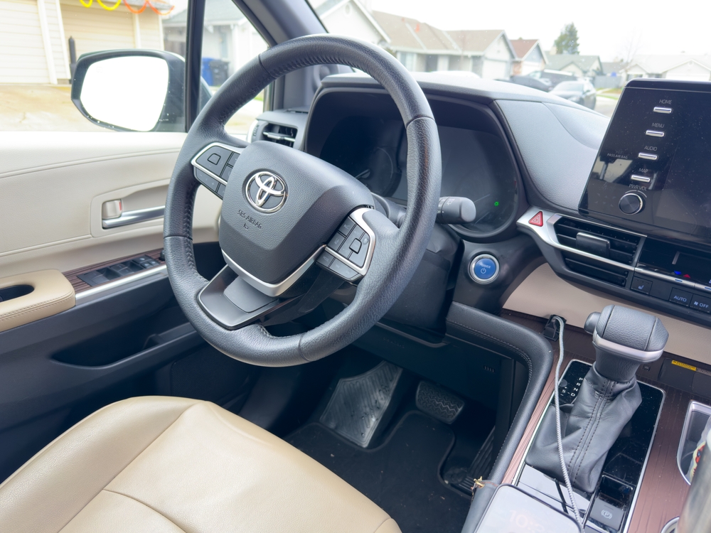 Steering wheel of a 2022 Toyota Sienna minivan in black