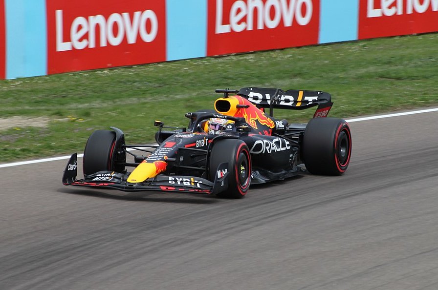Max Verstappen in a black racing car