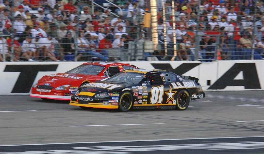 NASCAR racing cars driving next to each other