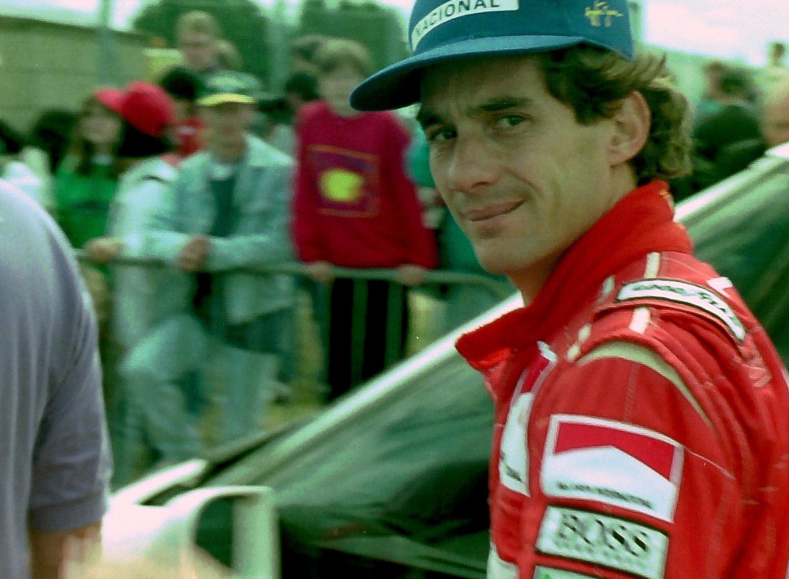 Formula 1 racer Ayrton Senna in a red jacket