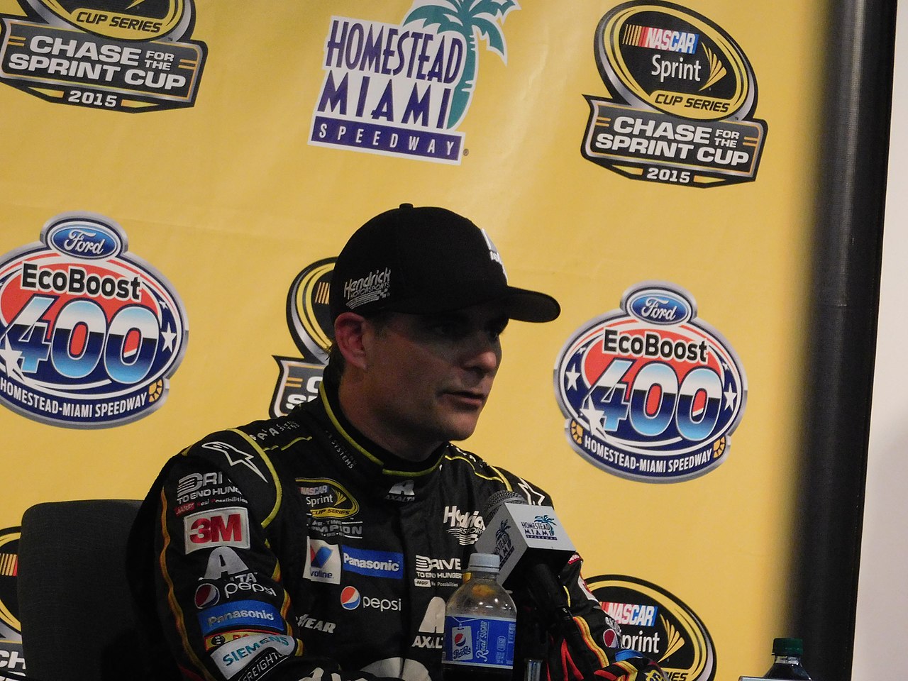 Jeff Gordon wearing a black cap