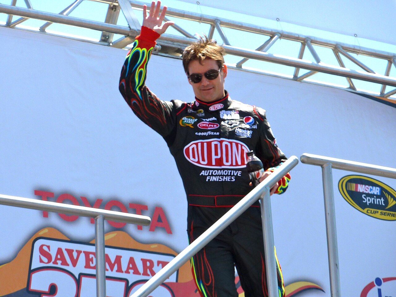 NASCAR racer Jeff Gordon waiving
