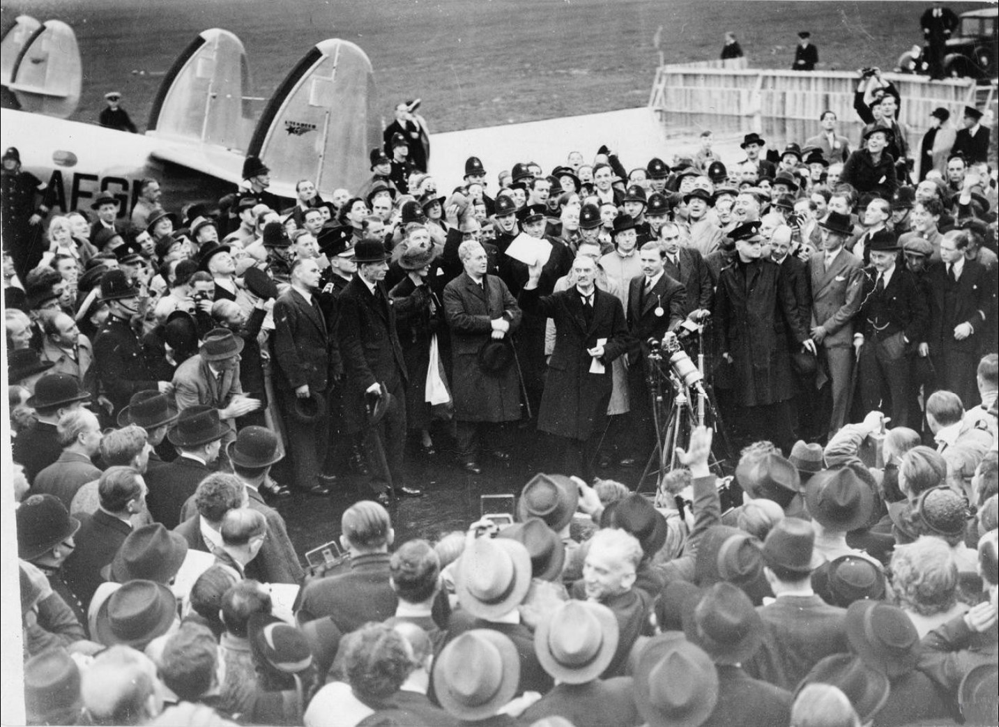 Neville Chamberlain holding the paper signed by Hitler