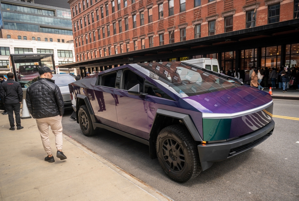 2024 Automotive enthusiasts ogle Tesla Cybertrucks on display outside the Tesla showroom