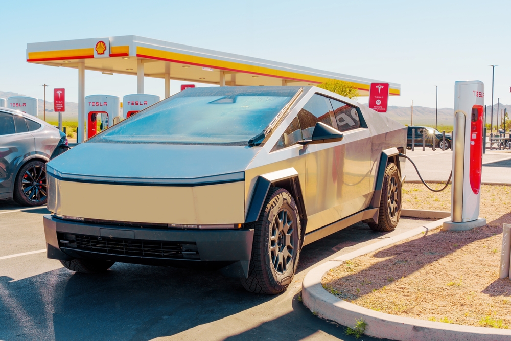 Charging Tesla Cybertruck at a Supercharger Station - 2024