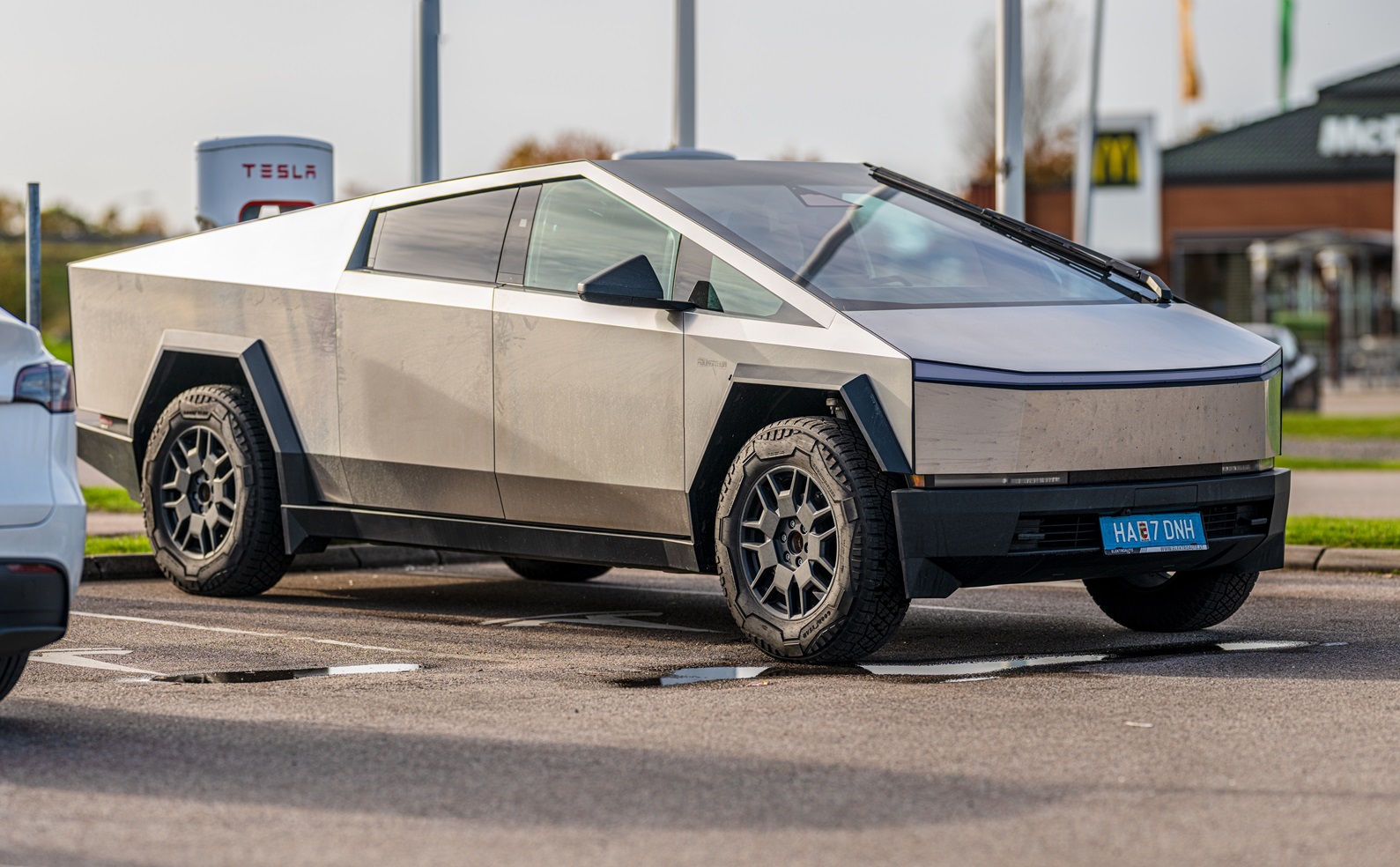 Tesla Cybertruck charging at a Tesla Supercharger - Sweden 2024