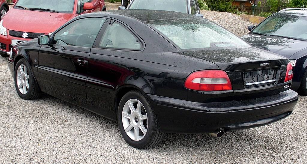 A close-up photo of a Black 1997 Volvo C70 Coupé car parked in a parking lot