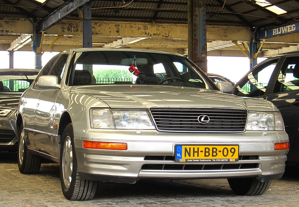 A close-up photo of a Silver 1995 Lexus LS 400 car parked in a parking lot