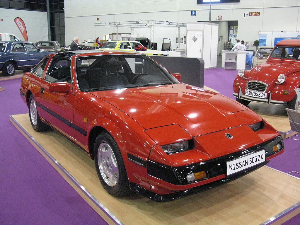 A close-up photo of a Red Nissan 300 ZX car on display at an exhibition