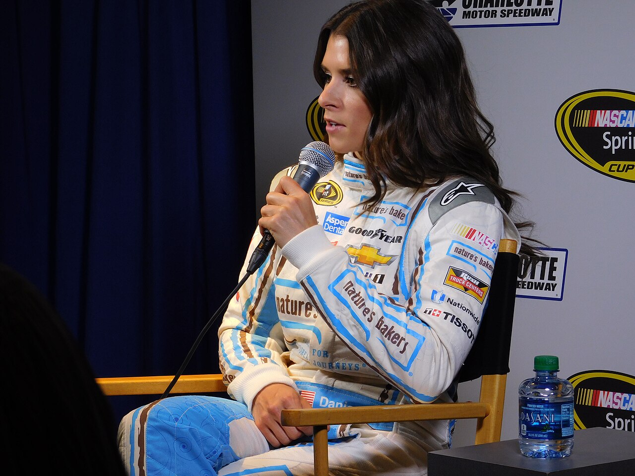 Danica Patrick in a white and blue jumpsuit