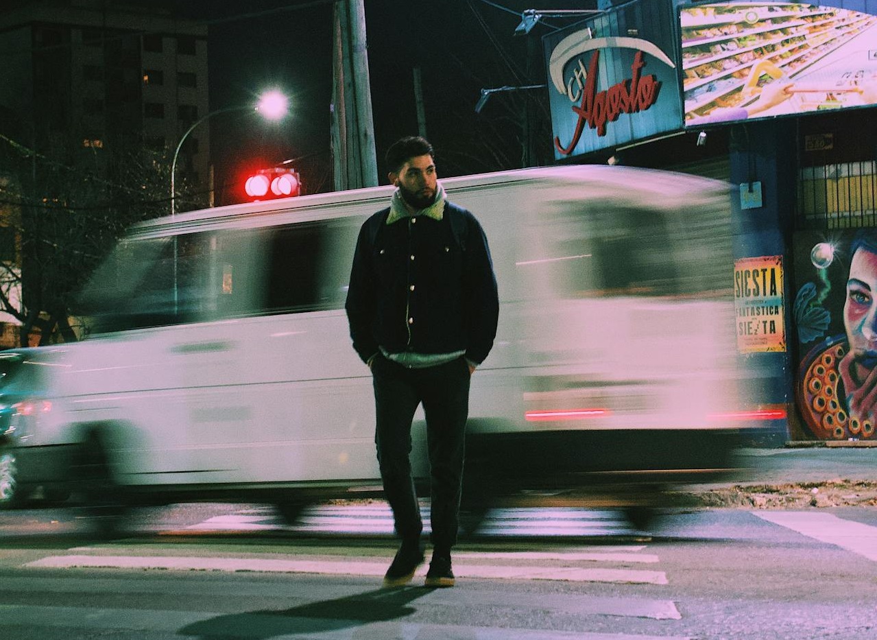 Man Walking on Pedestrian Crossing