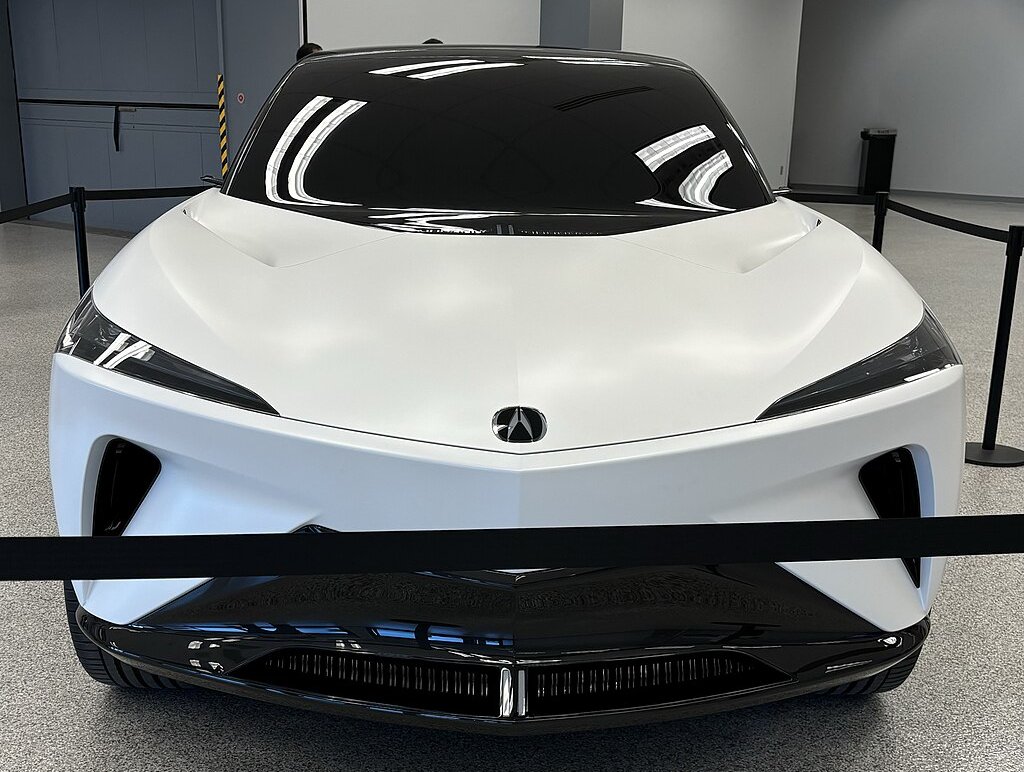 A close-up photo of a White Acura Performance EV car on display at an exhibition