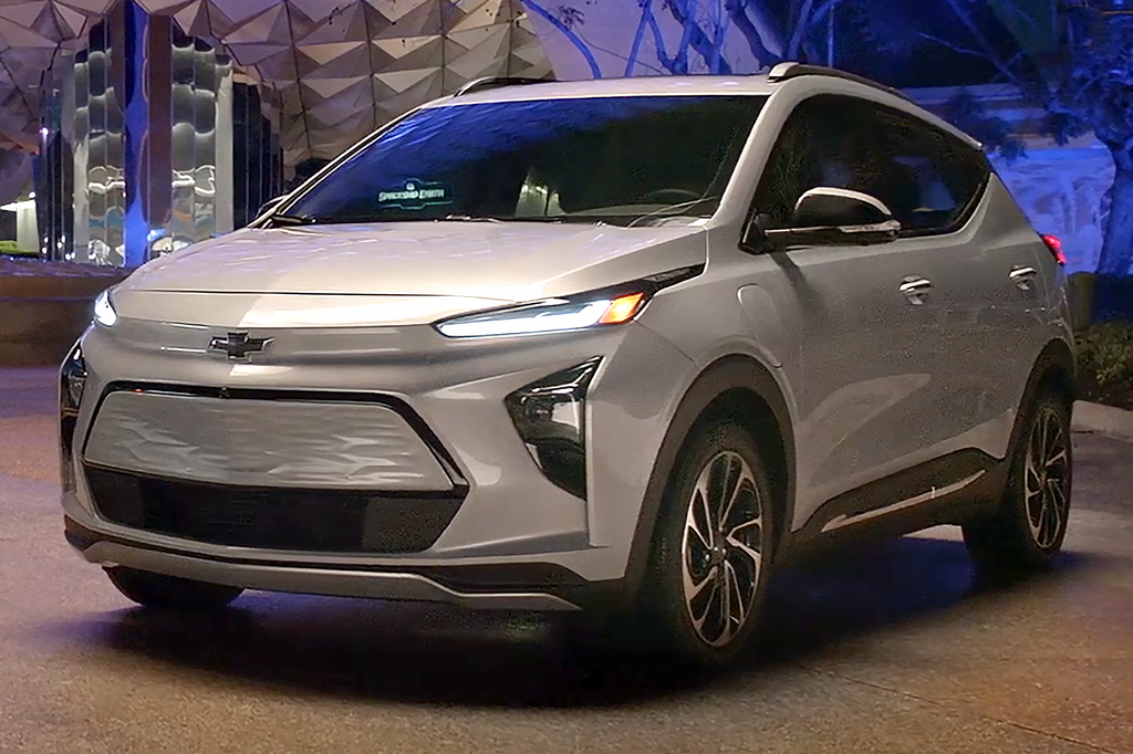 A close-up photo of a Silver Chevrolet Bolt EV car on display at an exhibition