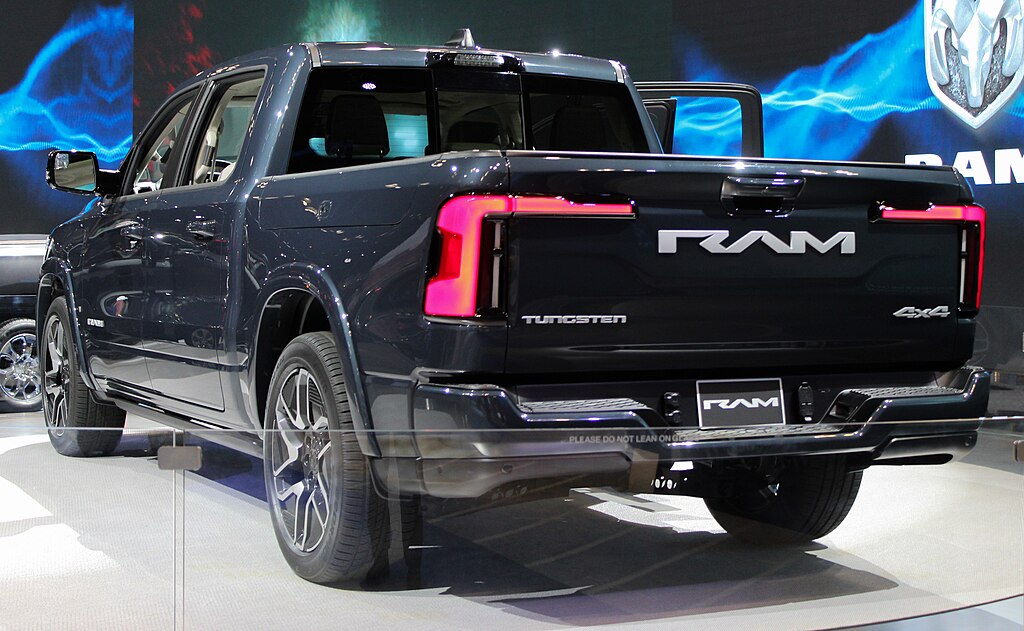 A close-up photo of a 2025 RAM 1500 REV car on display at an exhibition