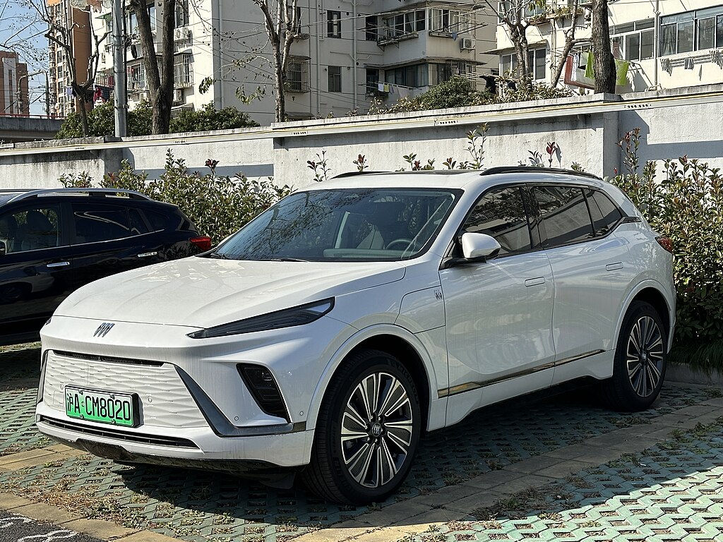 A close-up photo of a White Buick Electra car parked in a parking lot