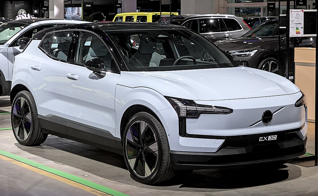 A close-up photo of a White Volvo EX30 car on display at an exhibition