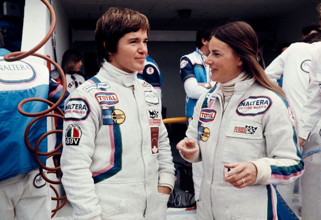 Lella Lombardi (L) and Belgian driver Christine Beckers (R) talk