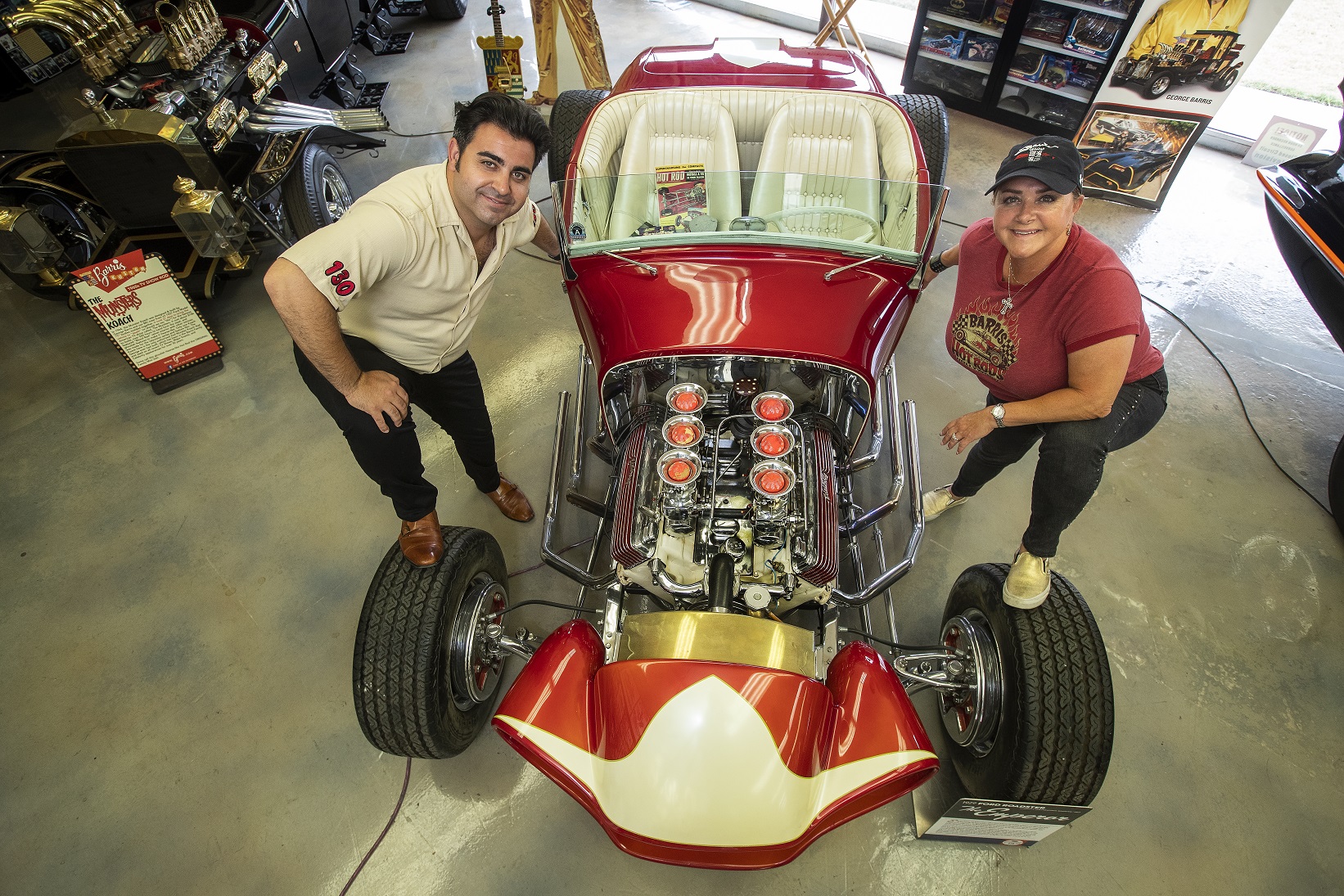 Jared Barris and his mother Joji Barris-Paster are photographed next to a roadster called, The Emperor - 2021