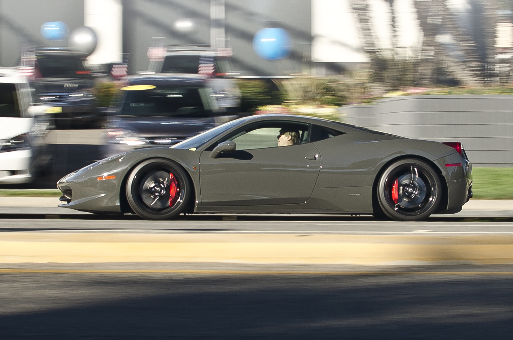 Grey Ferrari 458 Italia driving on the street - 2012