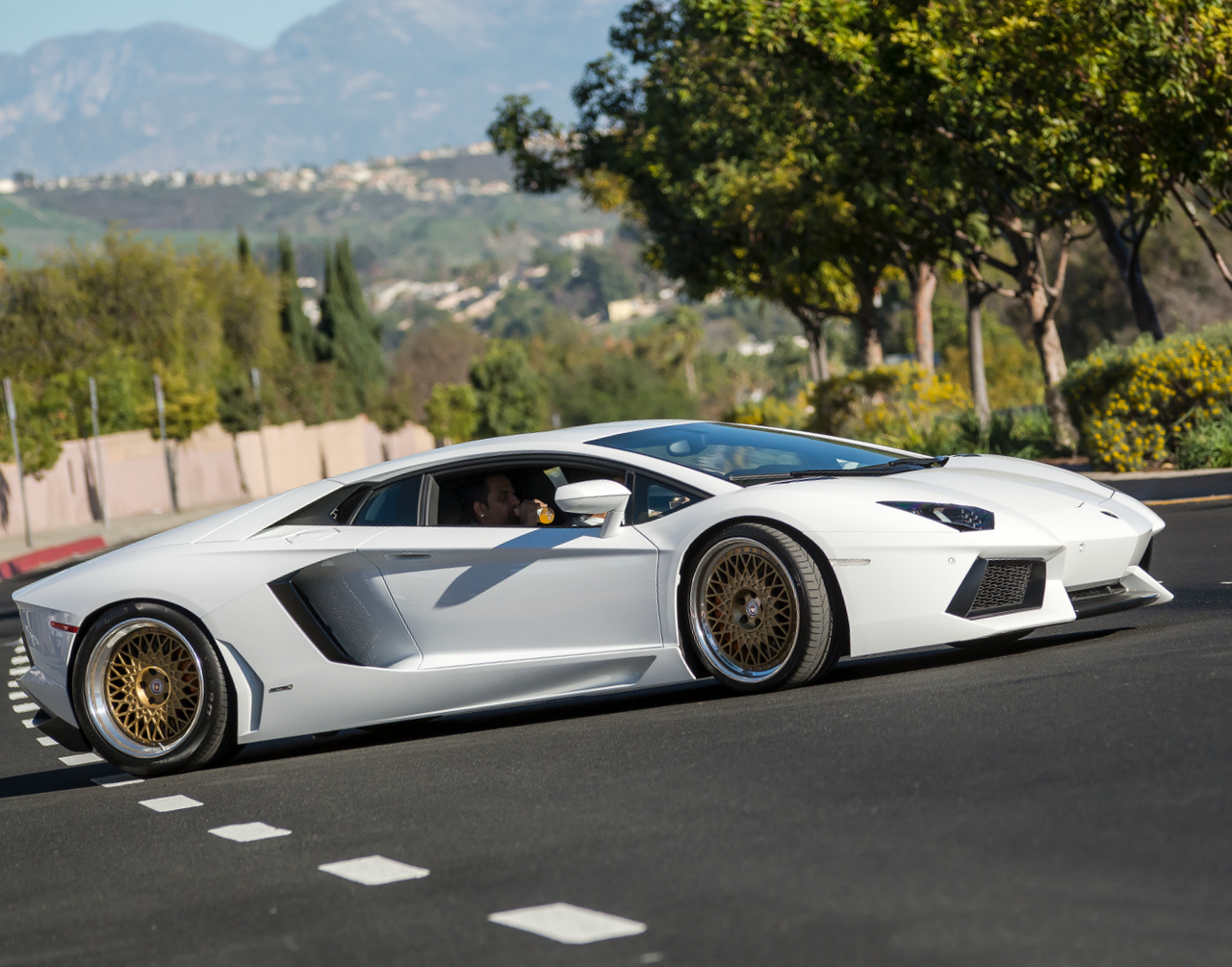 White Lamborghini Aventador on the road - 2015