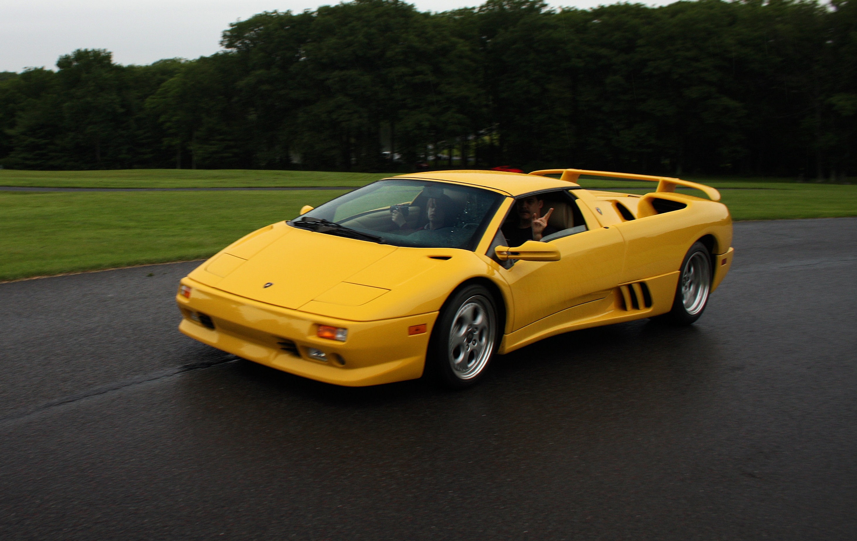 Yellow Lamborghini Diablo Roadster on the road.