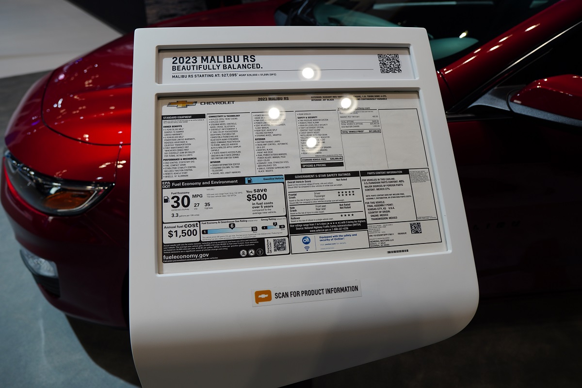 Sign with price information for the 2023 Chevrolet Malibu RS