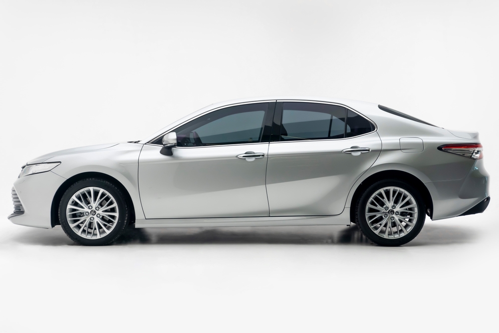 Side view of a silver toyota camry, studio photo, white background - 2022