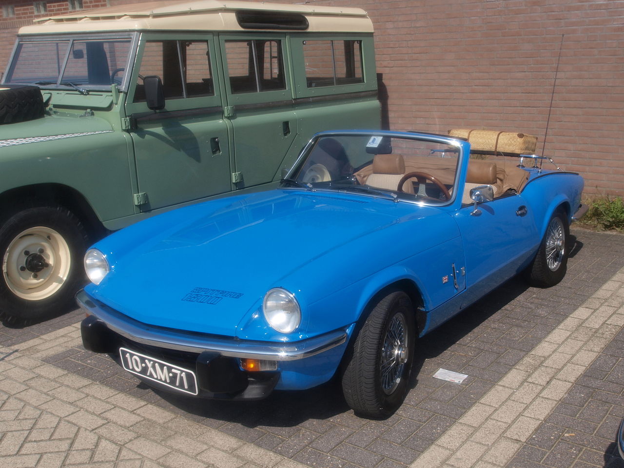 Blue 1978 Triumph Spitfire 1500 outside.