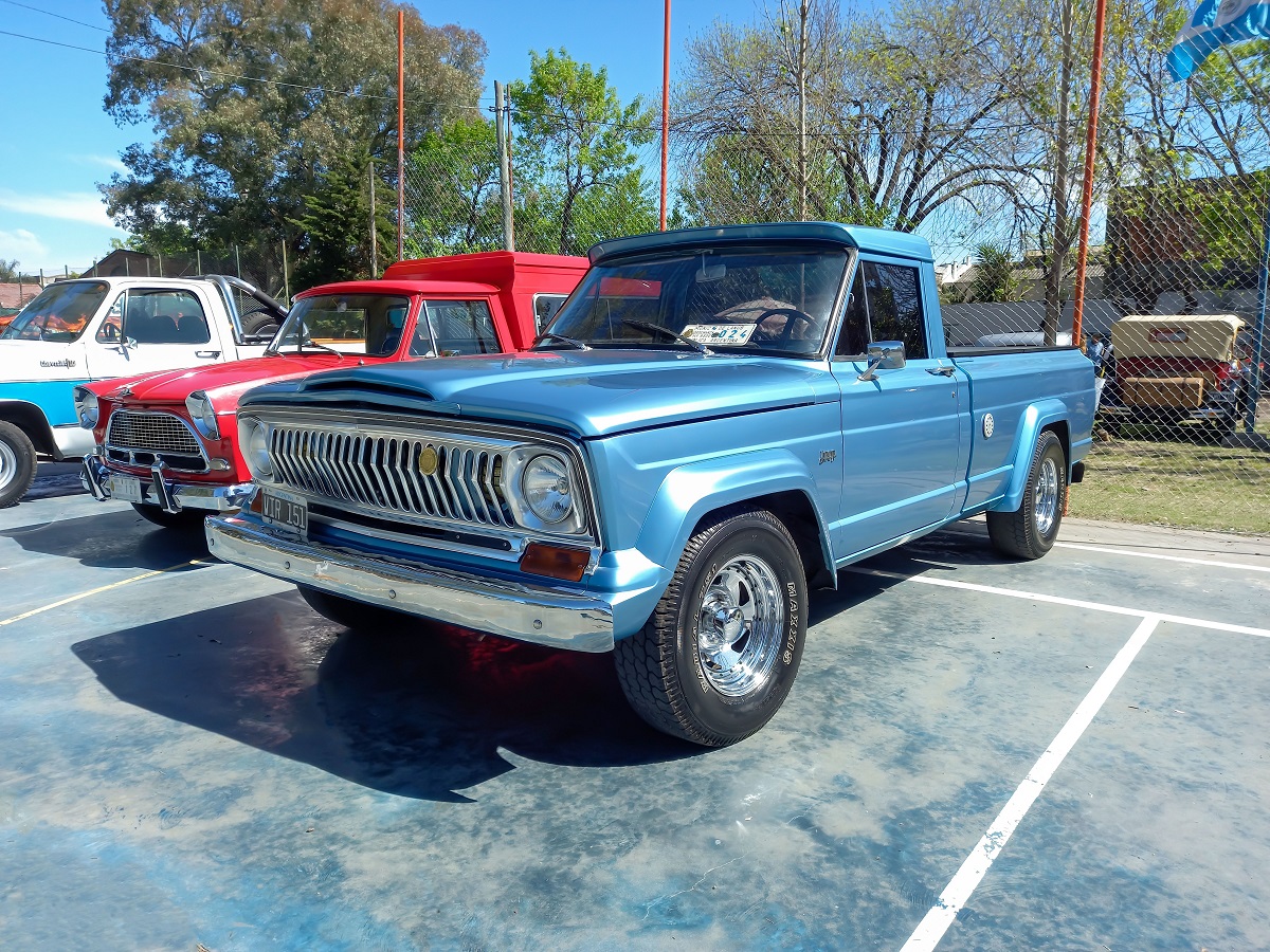 Metallic blue 1970s IKA Jeep Gladiator pickup truck.