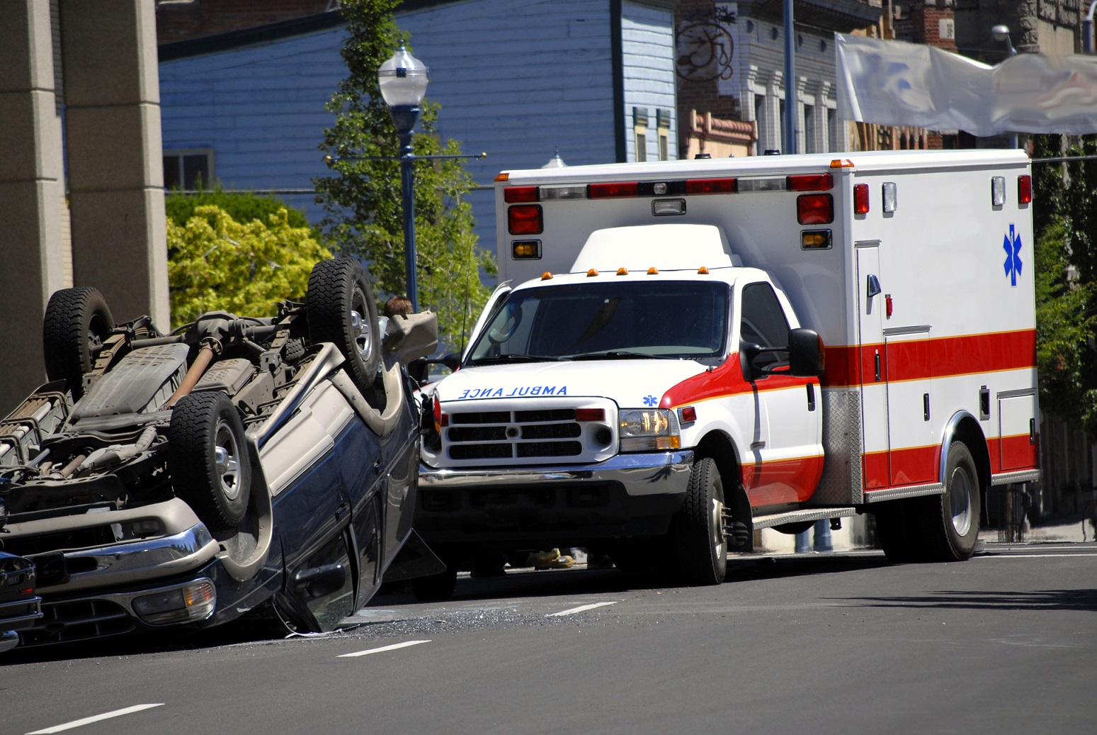 Car Wreck with Smashed Rolled Car and Ambulance