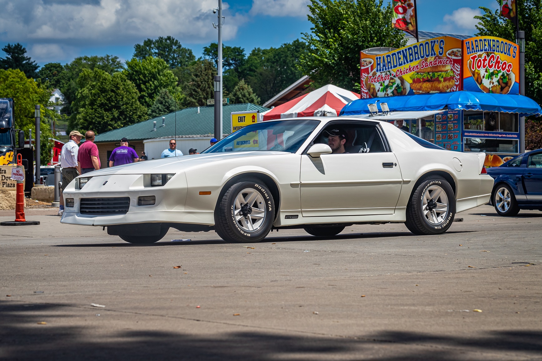 1991 Chevrolet Camaro RS Hardtop Coupe driving on a road.