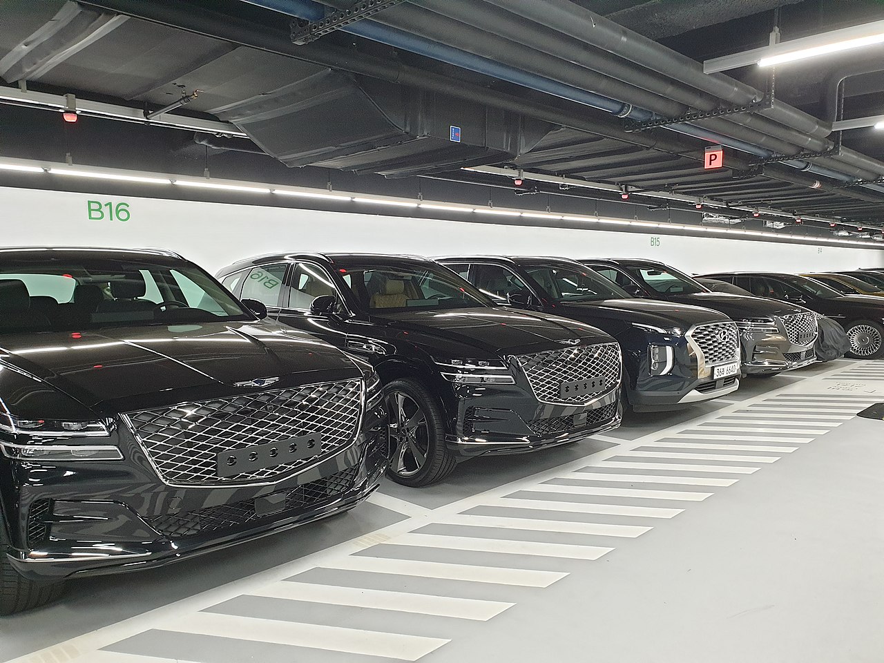Black Genesis Gv80S And Hyundai Palisade taken at a parking lot