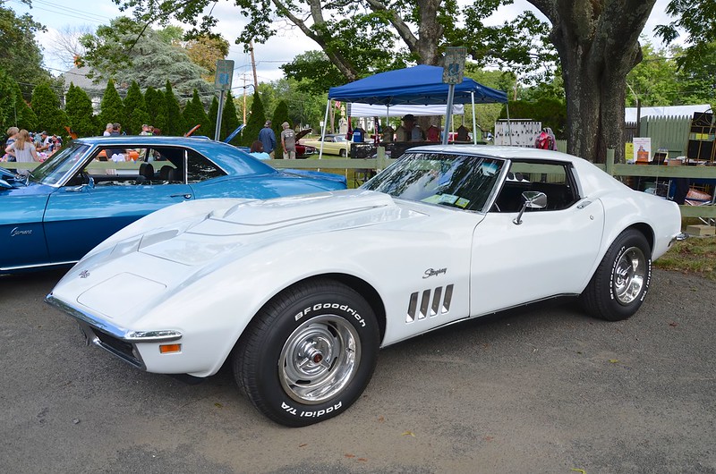 A white 1969 Chevrolet Corvette Stingray at an auto show in Southold.