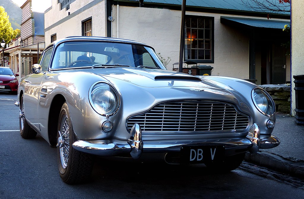 Silver 1963 Aston Martin DB5 parked on the street