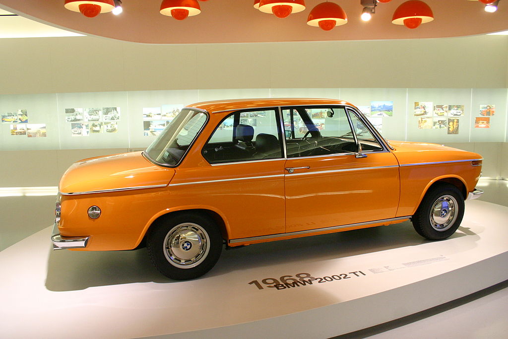 Close Up Photo of yellow 1968 BMW 2002