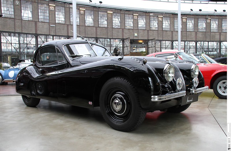 Close Up Photo of Black 1948 Jaguar XK 120 on a parking lot