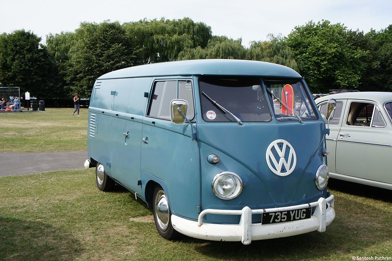 Blue 1950 Volkswagen Type 2 parked on grass