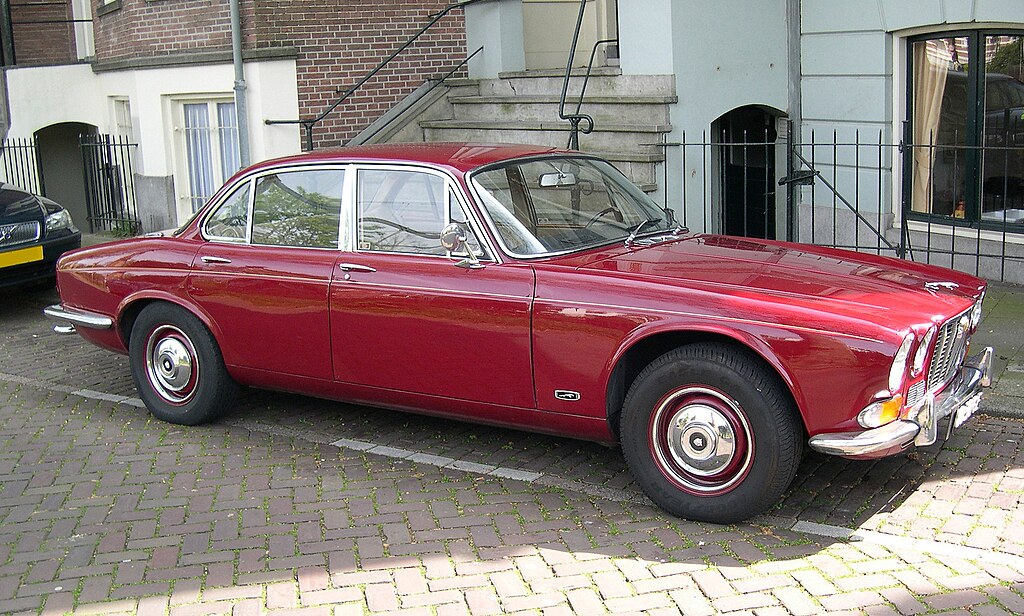 1968 Jaguar XJ6 Series parked in front of building