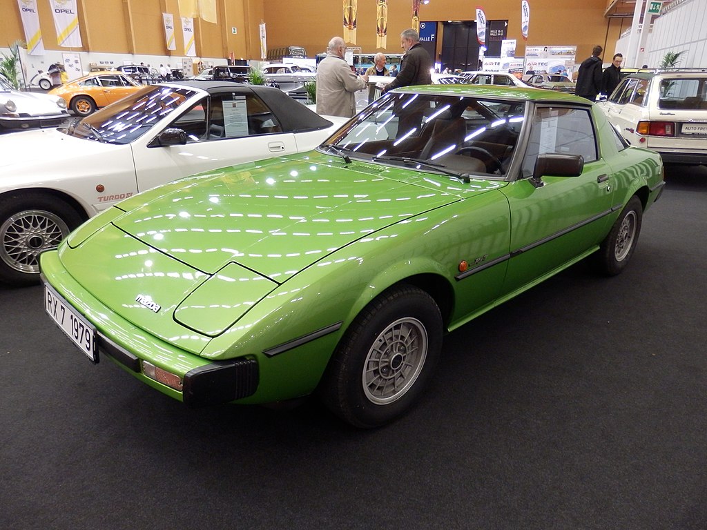Green 1979 Mazda RX-7 displayed on exhibition