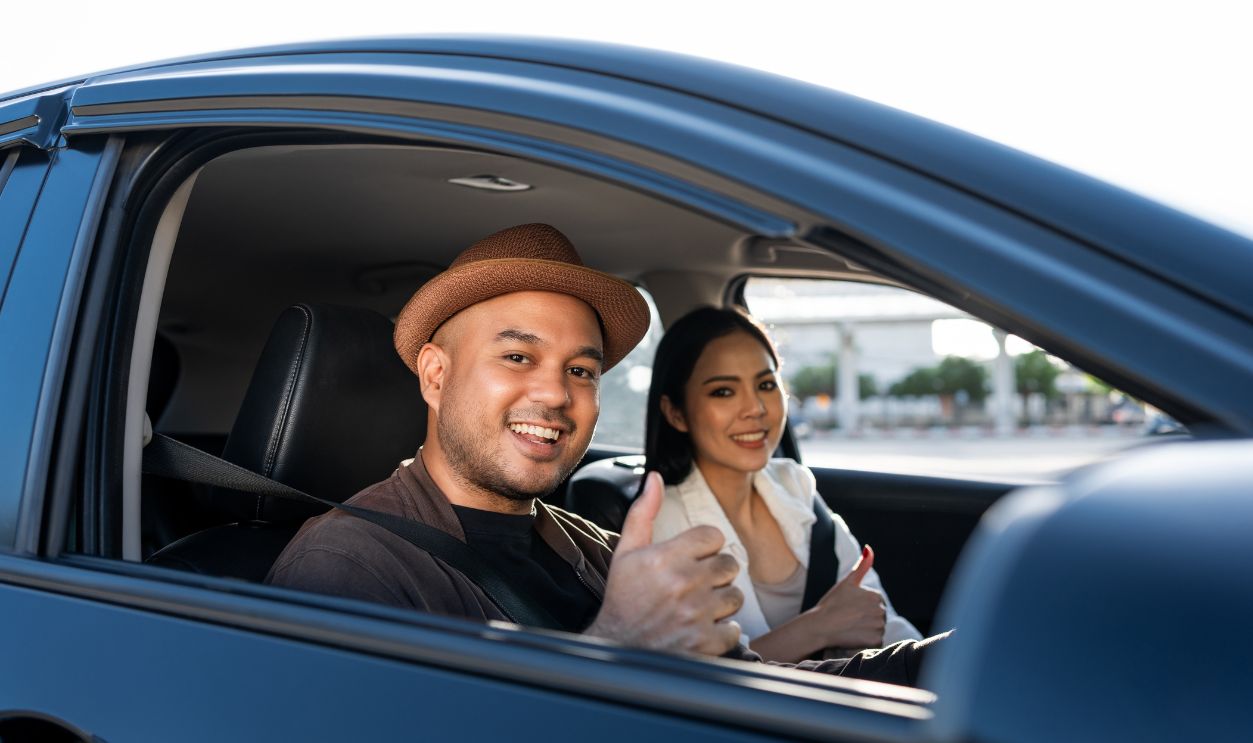 Young asian couple man and woman travel by car
