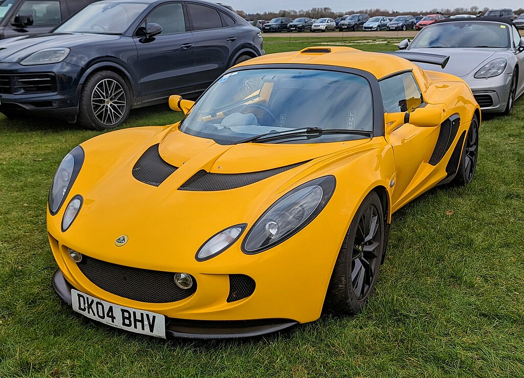 Close Up Photo of 2004 Lotus Exige parked on grass surface